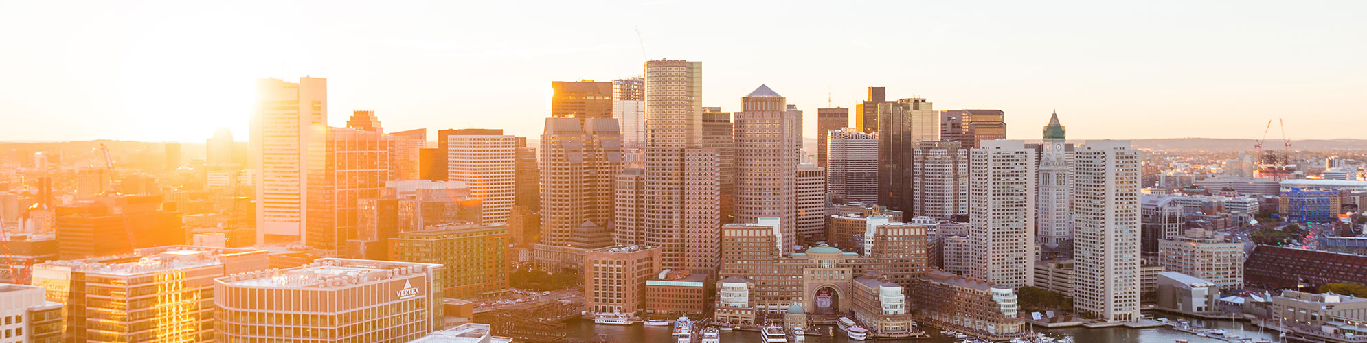Panoramic view of a city skyline at sunset, representing a hub for Cosmetic Surgery Experts by Dr. George Volpe